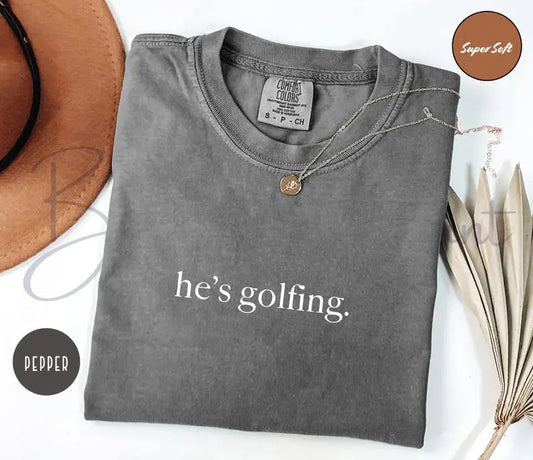 He's Golfing Shirt - Golfer Wife Tee, Comfort Colors Crewneck for Men & Women - Dogmomhat