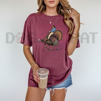 Festive Friction Tee – Cowboy Turkey Rodeo Funny Western Thanksgiving Graphic T-Shirt