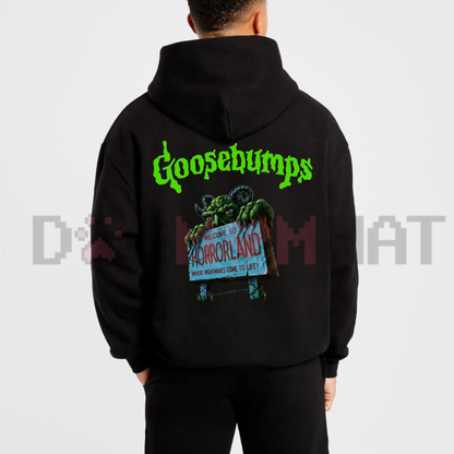 Back view of the Retro Goosebumps Horrorland Hoodie displaying the bold shoulder-to-shoulder typography and monster artwork across the upper back. - dogmomhat