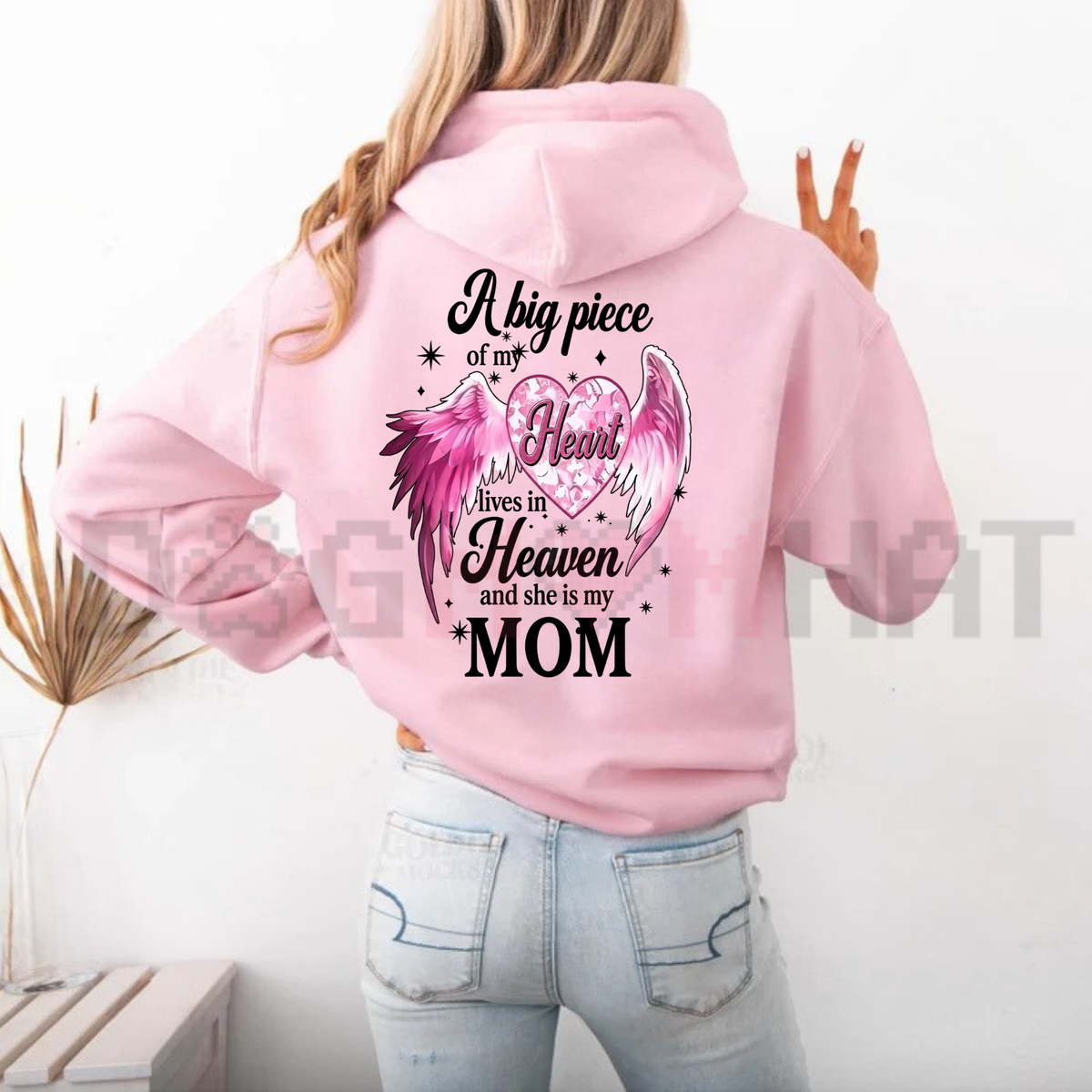 Back view of the parke horizon hoodie displaying 'A Big Piece Of My Heart Lives In Heaven Mom' pink angel wing back-print graphic artwork on a soft fleece pullover. - dogmomhat