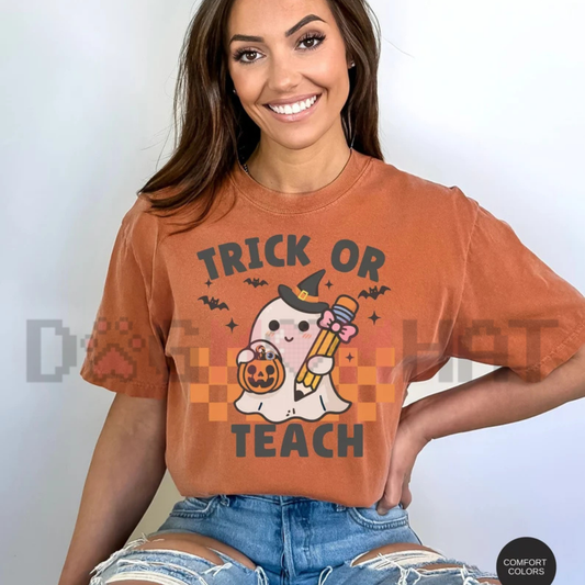 Front display of the Comfort Colors Trick Or Teach T-Shirt showing retro ghost teacher graphics on garment-dyed cotton fabric. - dogmomhat