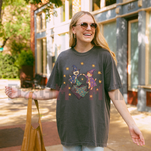 Front view of the 90s Wizard Cats T-Shirt displaying vintage kittens in wizard hats gathered in a mystical circle across the chest of a cotton crewneck tee. - dogmomhat