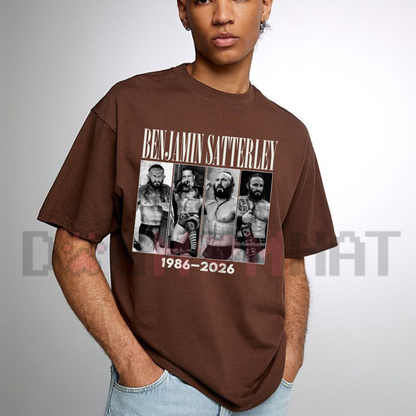 Front view of the Benjamin Satterley Vintage Tribute T-Shirt displaying iconic wrestling portrait collage and 1986-2026 typography printed across the chest. - dogmomhat