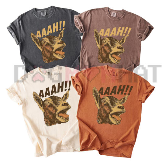 Front view of the Comfort Colors® Funny Halloween Goat Meme T-Shirt displaying quirky screaming goat graphic artwork printed across the chest. - dogmomhat