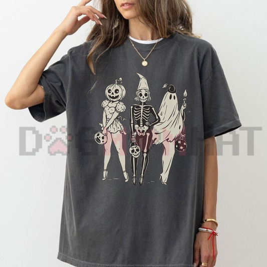 Front view of the Comfort Colors Vintage Halloween T-Shirt displaying the Spooky Girl Squad ghost, skeleton, and pumpkin graphic printed across the chest. - dogmomhat