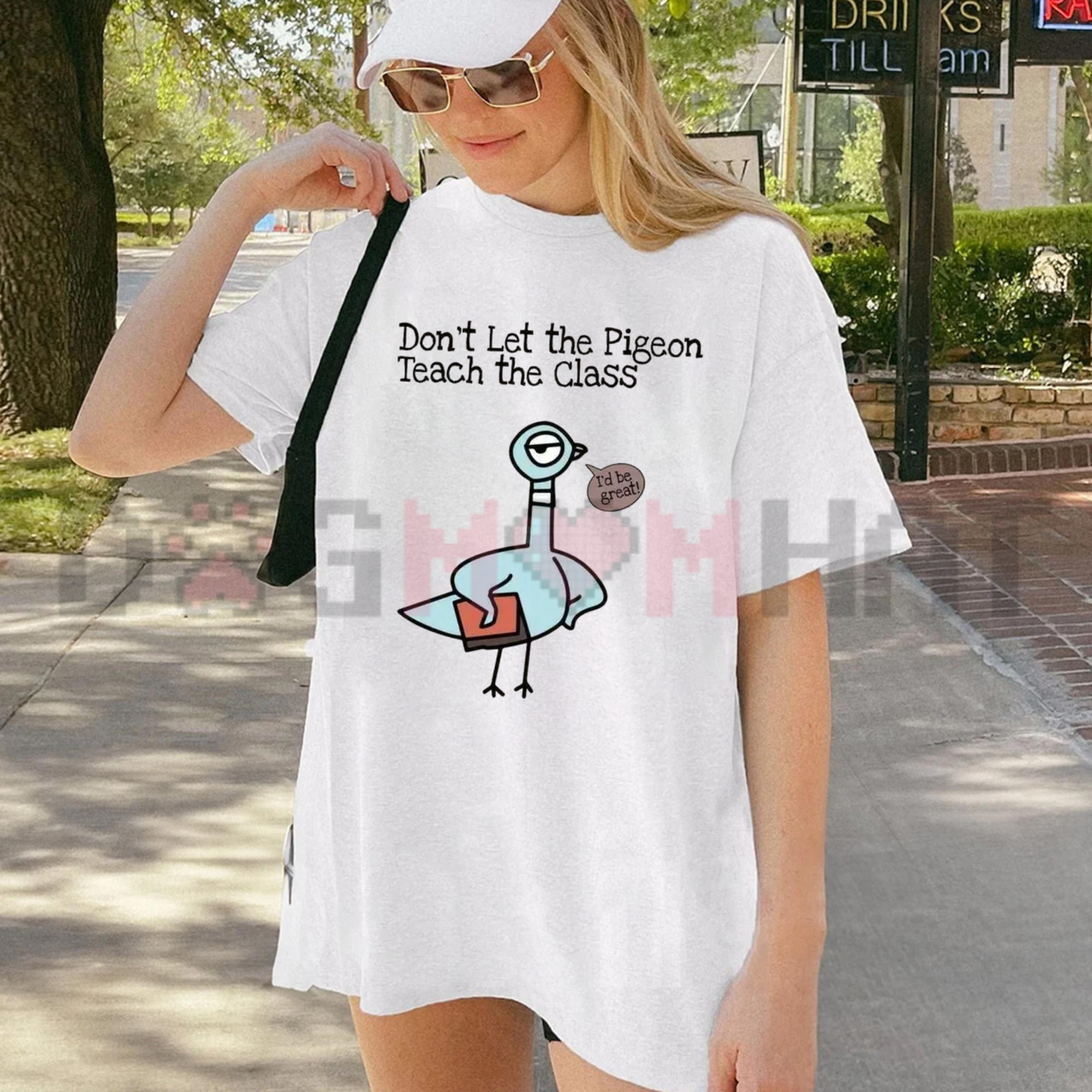 Front view of the Don't Let The Pigeon Teach The Class T-Shirt showing the funny teacher pigeon graphic printed across the chest - dogmomhat