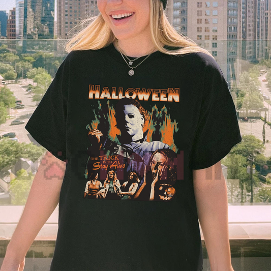 Front view of the Halloween 1978 T-Shirt displaying Michael Myers silhouette and glowing jack-o'-lantern artwork printed across the chest. - dogmomhat