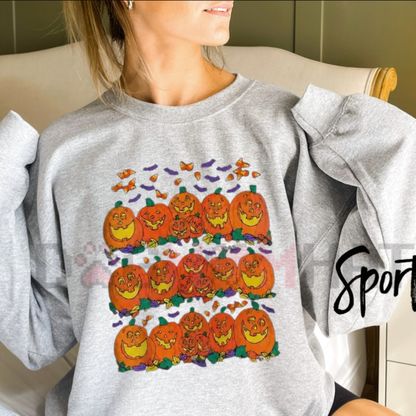 Front view of the Halloween Pumpkin Graphic Sweatshirt displaying cute spooky fall pumpkin artwork printed across the chest. - dogmomhat