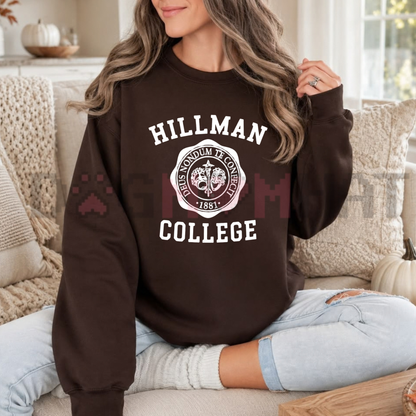 Front view of the Hillman College Sweatshirt displaying vintage collegiate arch lettering and crest artwork printed across the chest of a casual crewneck. - dogmomhat