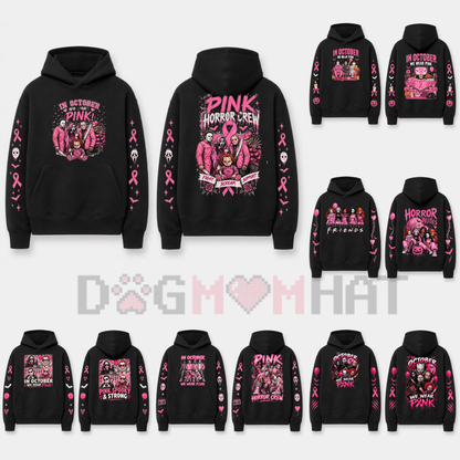Front view of the In October We Wear Pink Horror Hoodie displaying spooky movie characters with pink awareness ribbons printed on the chest. - dogmomhat