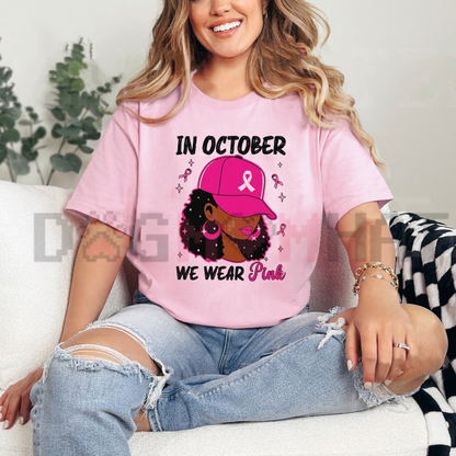 Front view of the In October We Wear Pink T-Shirt displaying pink heart and pumpkin graphic artwork printed across the chest. - dogmomhat