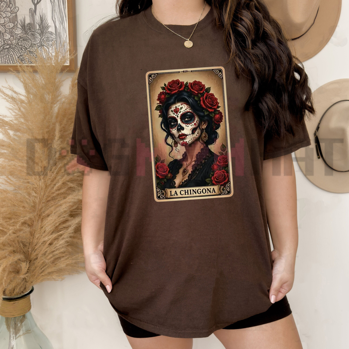 Front view of the La Chingona Tarot Card Sugar Skull T-Shirt displaying red rose and Day of the Dead graphic artwork printed across the chest. - dogmomhat