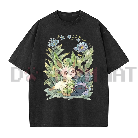 Front view of the Leafeon Vintage Acid Wash Graphic T-Shirt displaying the soft pastel botanical Pokémon art printed across the chest. - dogmomhat