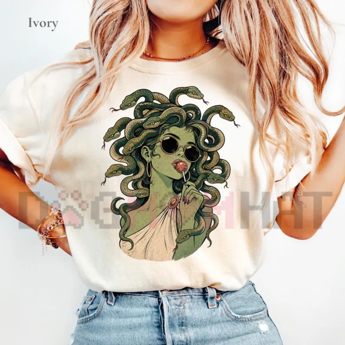 Front view of the Medusa Lollipop T-Shirt displaying spooky cute retro cartoon Medusa licking a swirl lollipop printed across the chest. - dogmomhat