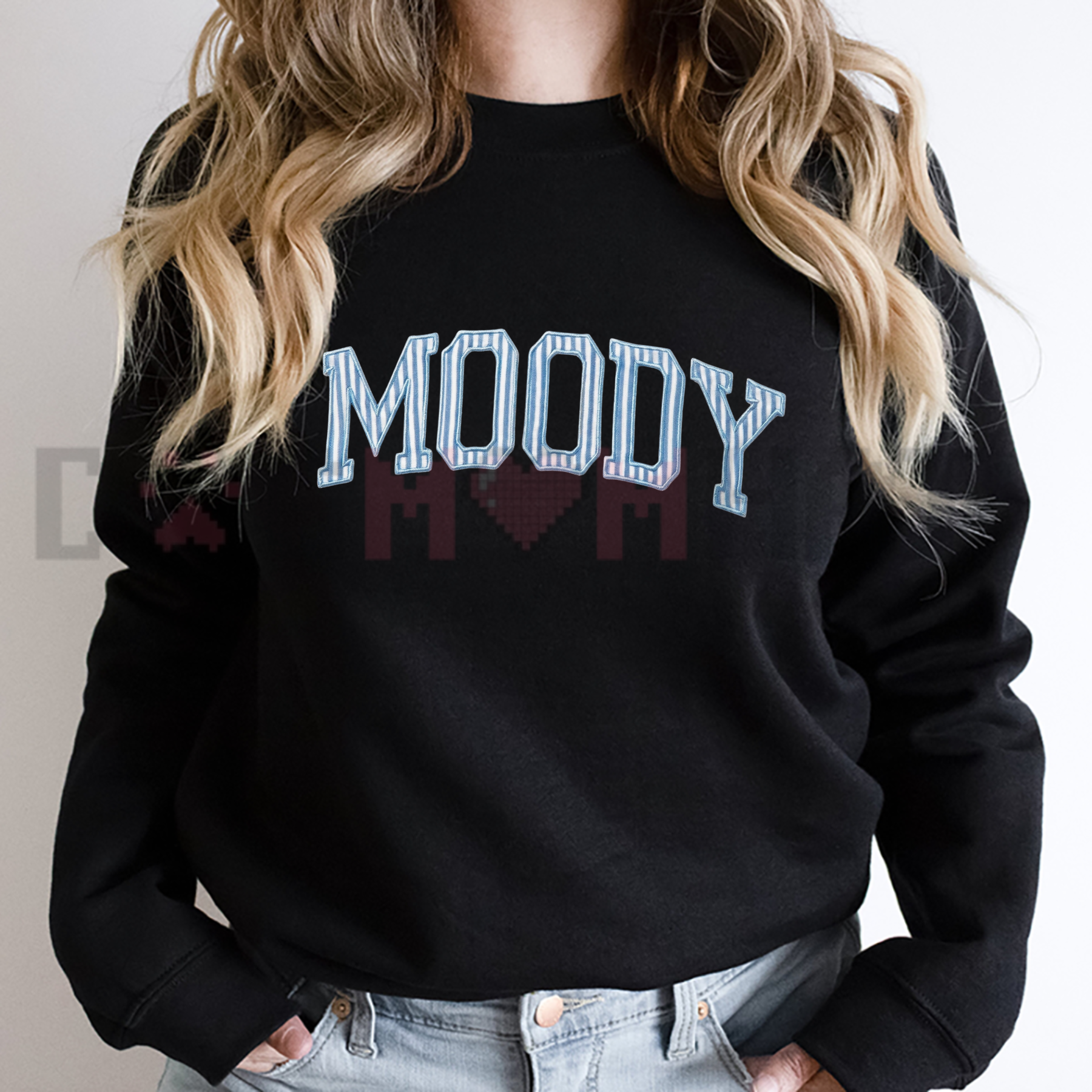 Front view of the Moody Embroidered Sweatshirt showing the detailed minimalist text thread design on the chest - dogmomhat