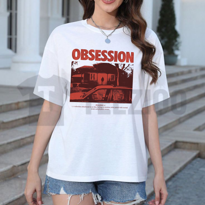 Front view of the Obsession Retro Horror Graphic T-Shirt displaying the vintage 80s thriller artwork printed across the chest. - teezioo
