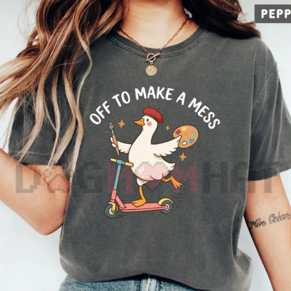 Front view of the Off To Make A Mess Artist Goose T-Shirt displaying cute painter goose and paint palette graphics printed across the chest. - DOGMOMHAT