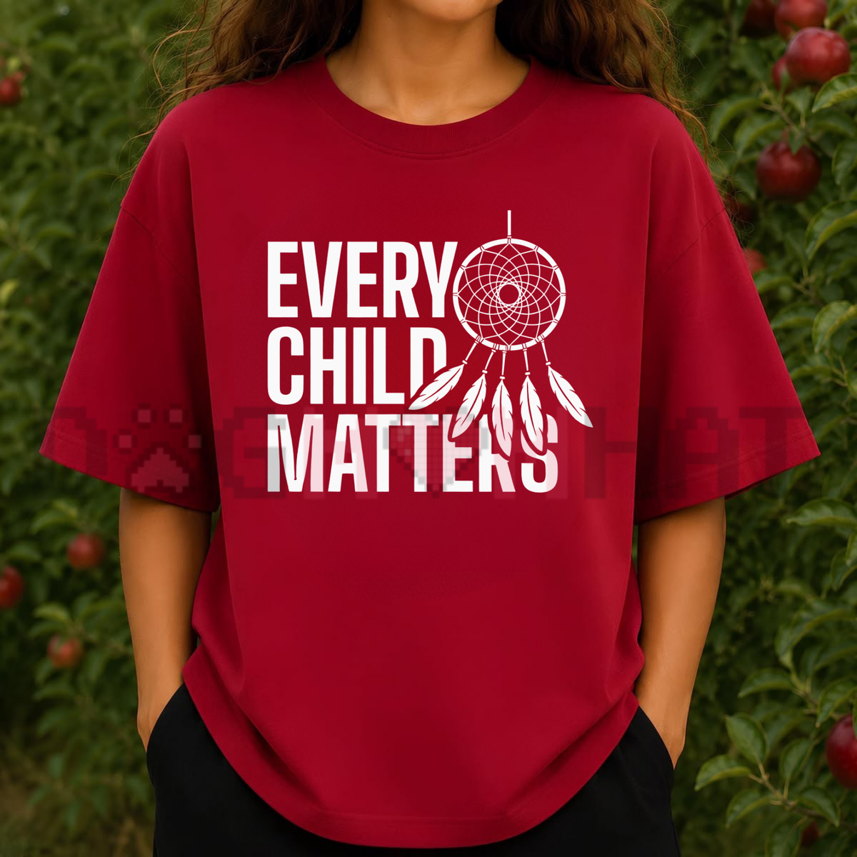 Front view of the Orange Day Shirt displaying sacred Native feather graphics and Every Child Matters typography printed across the chest.  - dogmomhat