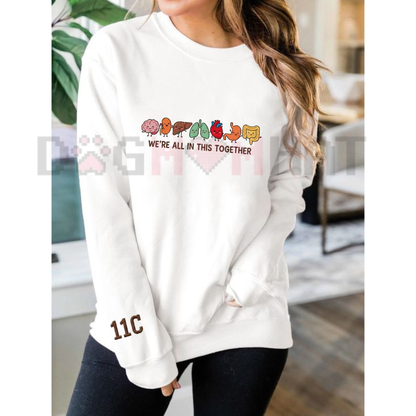 Front view of the Parke Horizon sweatshirt displaying intricately embroidered funny cartoon anatomy organs with cheerful faces across the chest of a soft fleece crewneck pullover. - dogmomhat