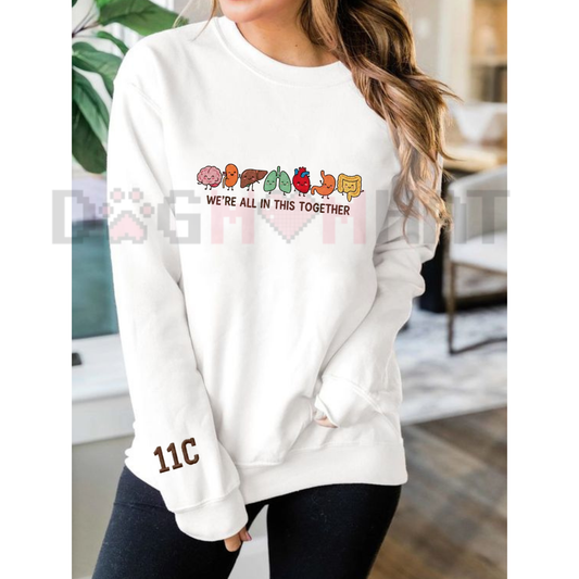 Front view of the Parke Horizon sweatshirt displaying intricately embroidered funny cartoon anatomy organs with cheerful faces across the chest of a soft fleece crewneck pullover. - dogmomhat