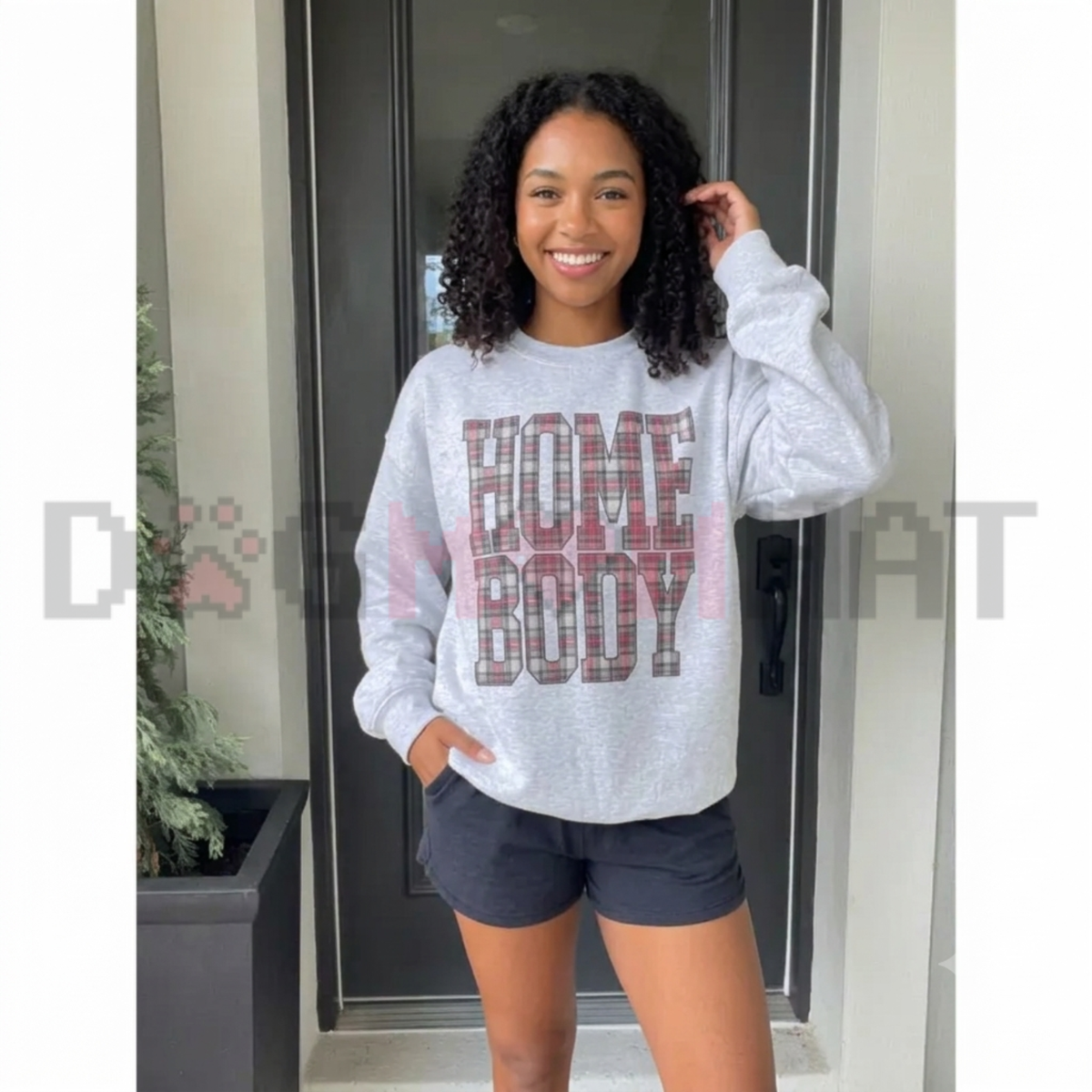 Front view of the Red Plaid Homebody Sweatshirt displaying buffalo check plaid Homebody typography printed across the chest of a casual fleece crewneck. - dogmomhat