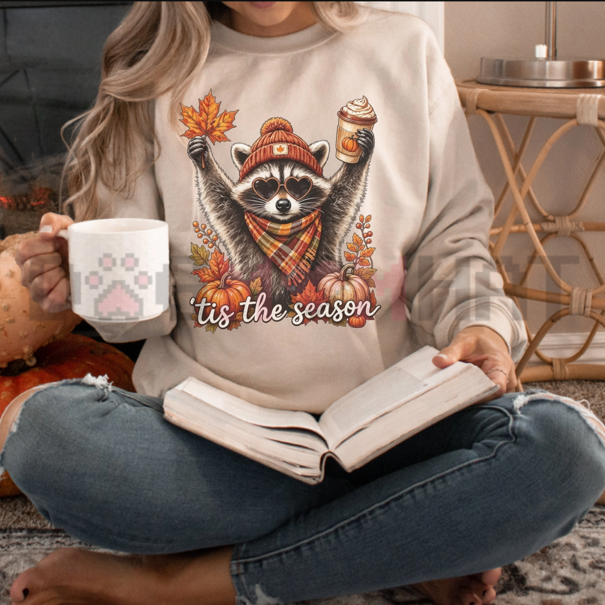 Front view of the Retro Autumn Raccoon Sweatshirt displaying raccoon pumpkin coffee graphic artwork printed across the chest of a casual fleece crewneck. - dogmomhat