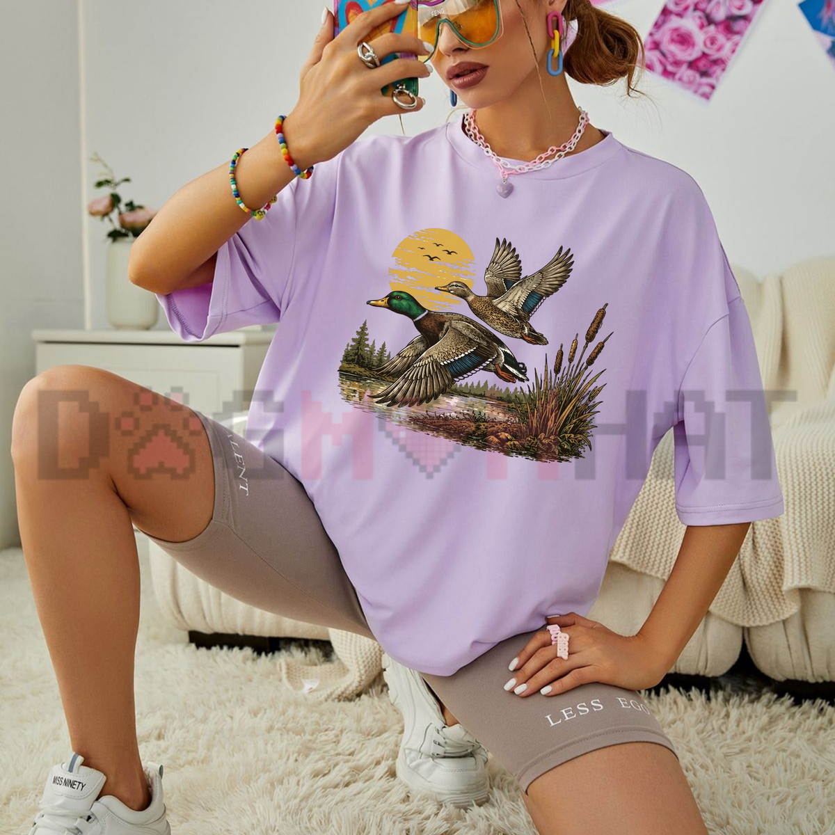 Front view of the Retro Flying Mallard Duck T-Shirt displaying flying mallard graphic and wetland hunting emblem printed across the chest. - dogmomhat