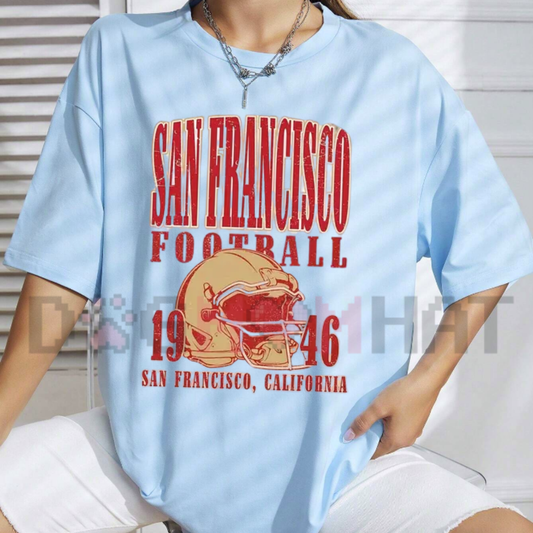 Front view of the San Francisco Football 1946 Helmet Vintage T-Shirt displaying retro 1946 football helmet graphics across the chest of a cotton crewneck tee. - dogmomhat