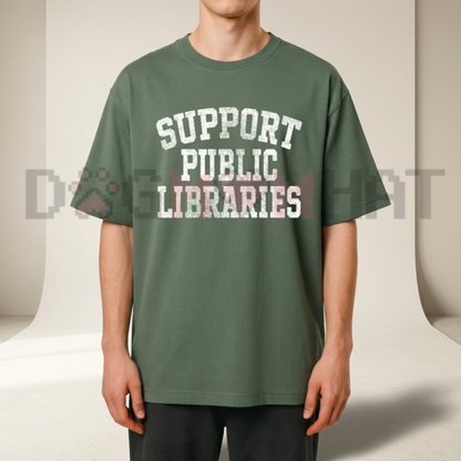 Front view of the Support Public Libraries T-Shirt displaying vintage stacked books graphic artwork printed across the chest. - dogmomhat