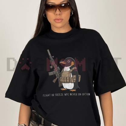 Front view of the Tactical Penguin T-Shirt showing the armed penguin and "Flight Was Never An Option" text printed across the chest - dogmomhat