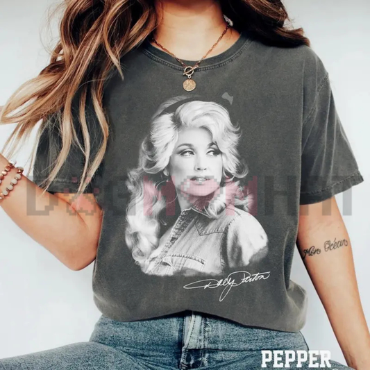 Front view of the Vintage Dolly Parton Portrait Comfort Colors T-Shirt showing the detailed retro portrait graphic printed across the chest. - dogmomhat