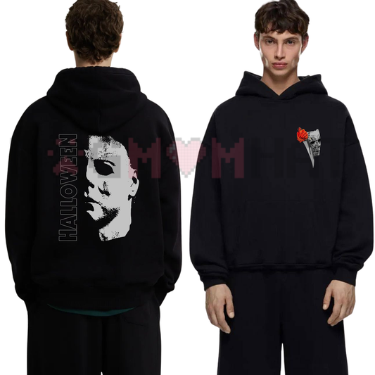 Front view of the Vintage Horror Icon Halloween Graphic Hoodie displaying retro slasher mask artwork printed across the chest. - dogmomhat