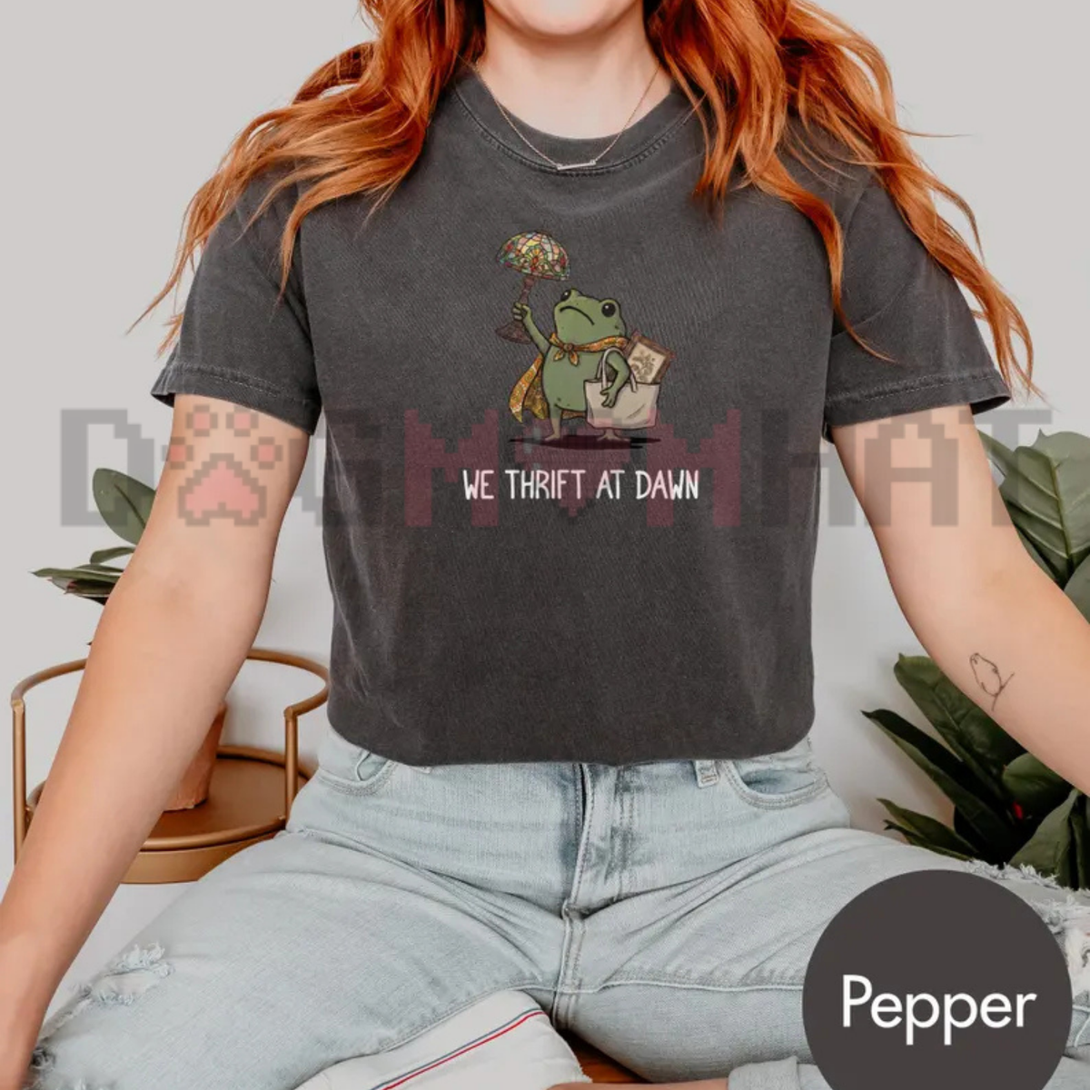 Front view of the We Thrift At Dawn Funny Frog Meme T-Shirt displaying thrifting frog artwork printed across the chest. - dogmomhat