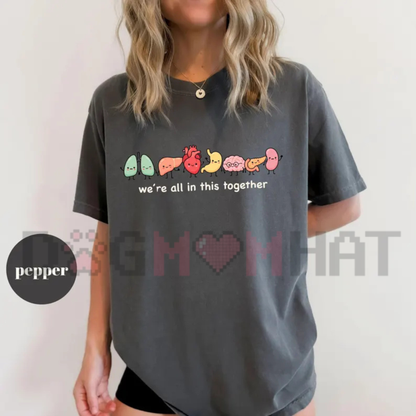 Front view of the We're All In This Together Cute Organ Anatomy T-Shirt displaying cartoon organ graphics printed across the chest. - DOGMOMHAT