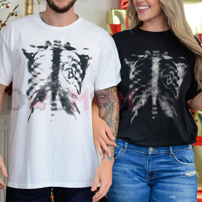 Front view of the anatomical inverted radiograph tee displaying skeleton ribcage x-ray graphic artwork across the chest of a black cotton shirt. - dogmomhat