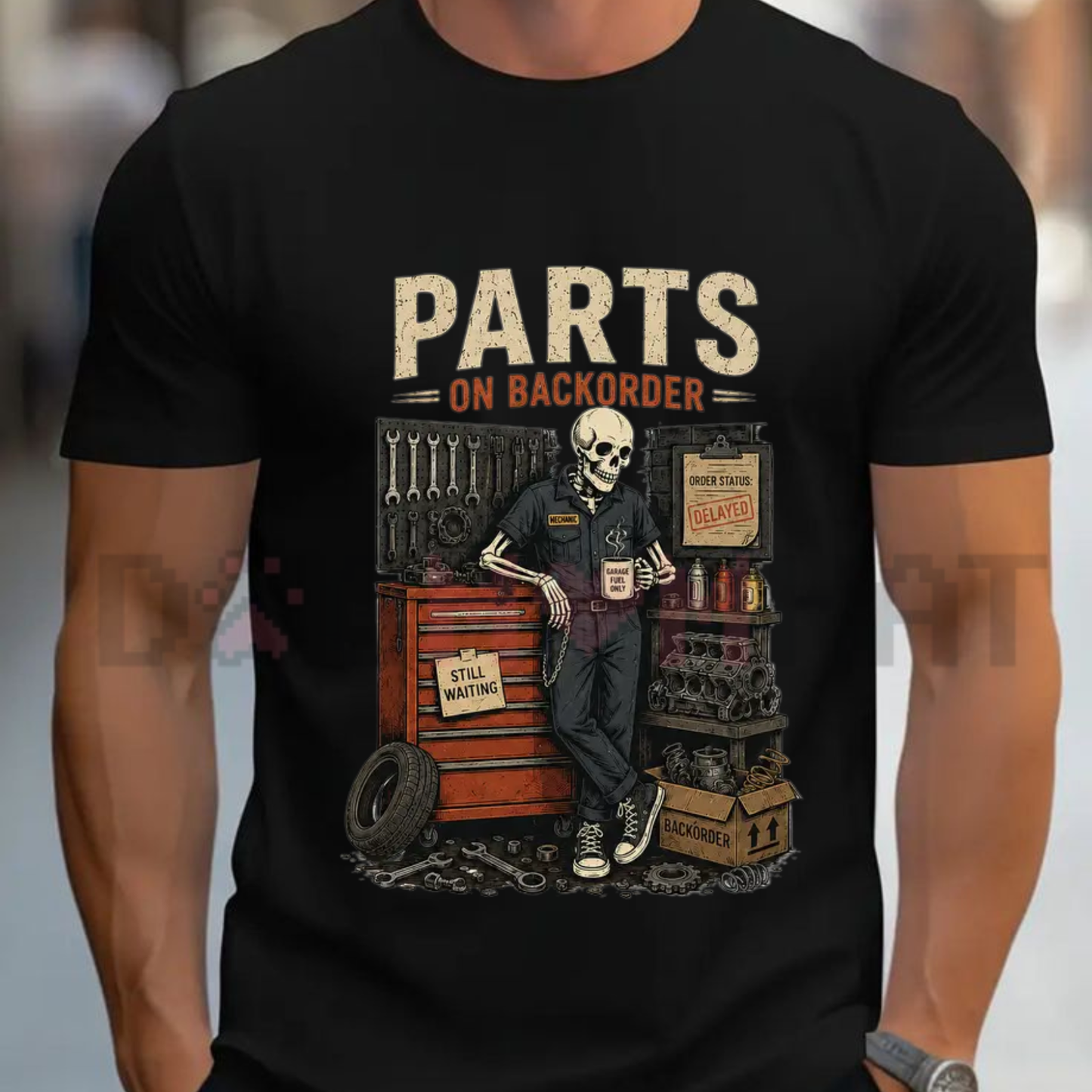 Front view of the black Waiting On Parts Skeleton Graphic T-Shirt showing the detailed mechanic skeleton artwork printed across the chest - dogmomhat