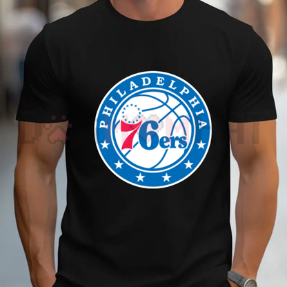 Front view of the blue Philadelphia 76ers Graphic T-Shirt showing the detailed team logo printed across the chest - dogmomhat