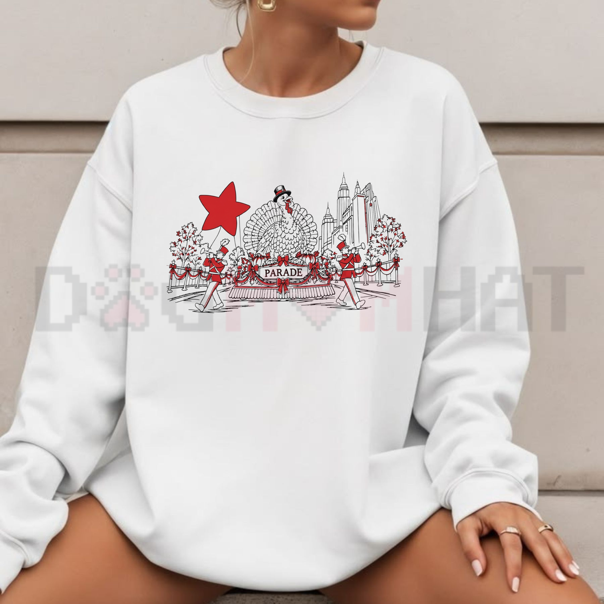 Front view of the festive friction crewneck displaying 100th Thanksgiving Day Parade NYC graphic artwork across the chest of a soft fleece sweatshirt. - dogmomhat