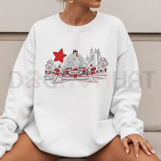 Front view of the festive friction crewneck displaying 100th Thanksgiving Day Parade NYC graphic artwork across the chest of a soft fleece sweatshirt. - dogmomhat