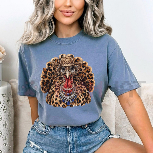 Front view of the festive friction tee displaying rhinestone leopard turkey glam graphic artwork across the chest of a soft relaxed crewneck shirt. - dogmomhat