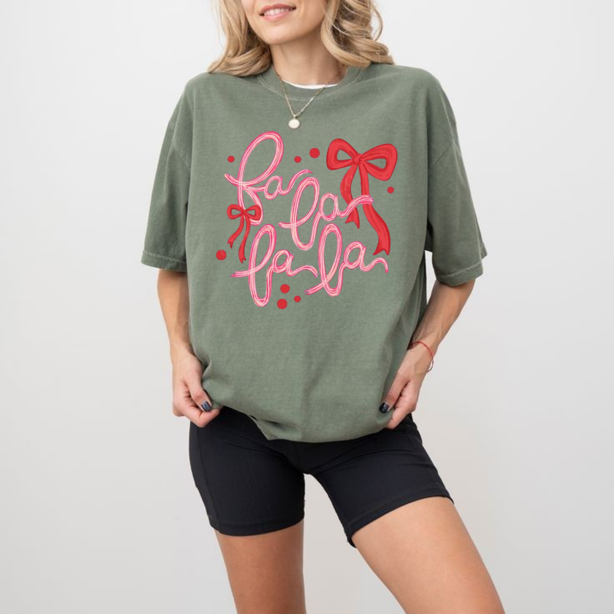 Front view of the festive friction tee displaying trendy retro Fa La La Christmas graphic artwork across the chest of a garment-dyed shirt. - dogmomhat