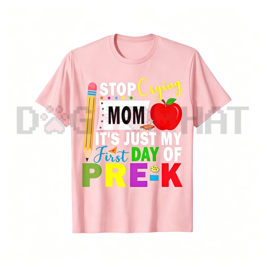 Front view of the light blue First Day of Pre-K Graphic T-Shirt showing the funny "Stop Crying Mom" colorful text printed across the chest - dogmomhat