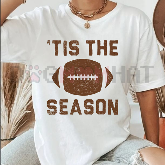 Front view of the navy blue Tis The Football Season Graphic T-Shirt showing the detailed retro game day artwork printed across the chest - dogmomhat