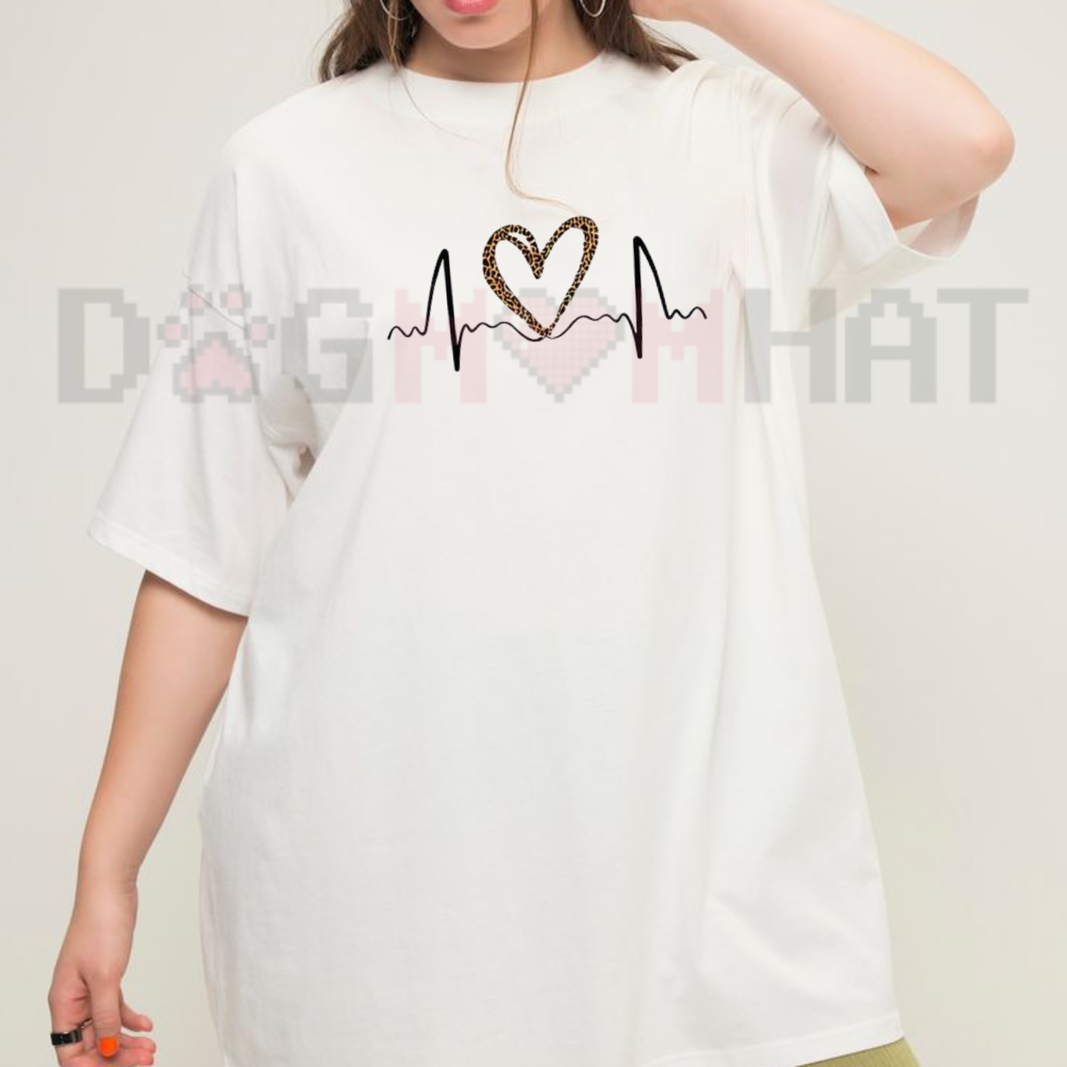 Front view of the parke horizon tee displaying leopard print heart ECG graphic artwork across the chest of a casual oversized crewneck shirt. - dogmomhat