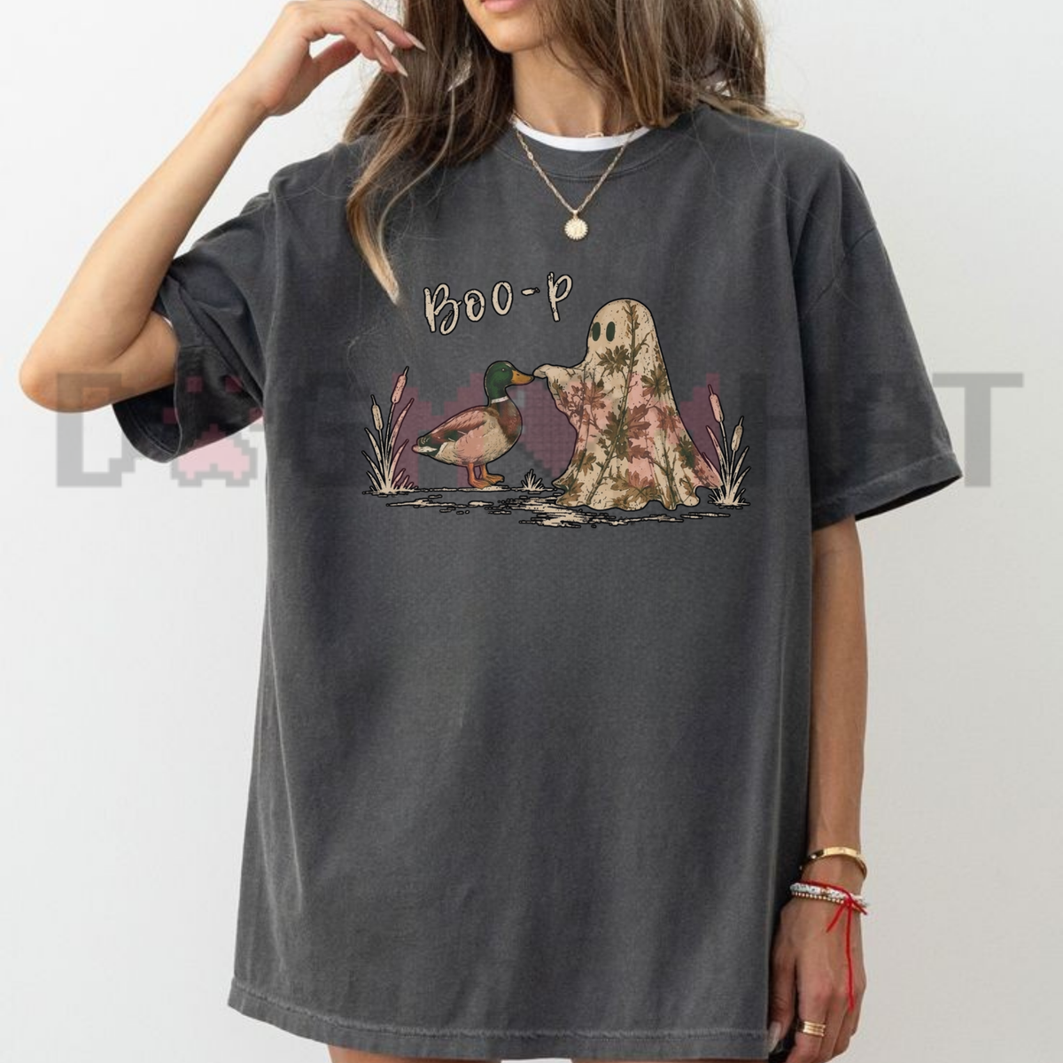 Front view of the quack-o-lantern squad tee displaying funny duck in camo ghost costume graphic artwork across the chest of a Comfort Colors shirt. - dogmomhat