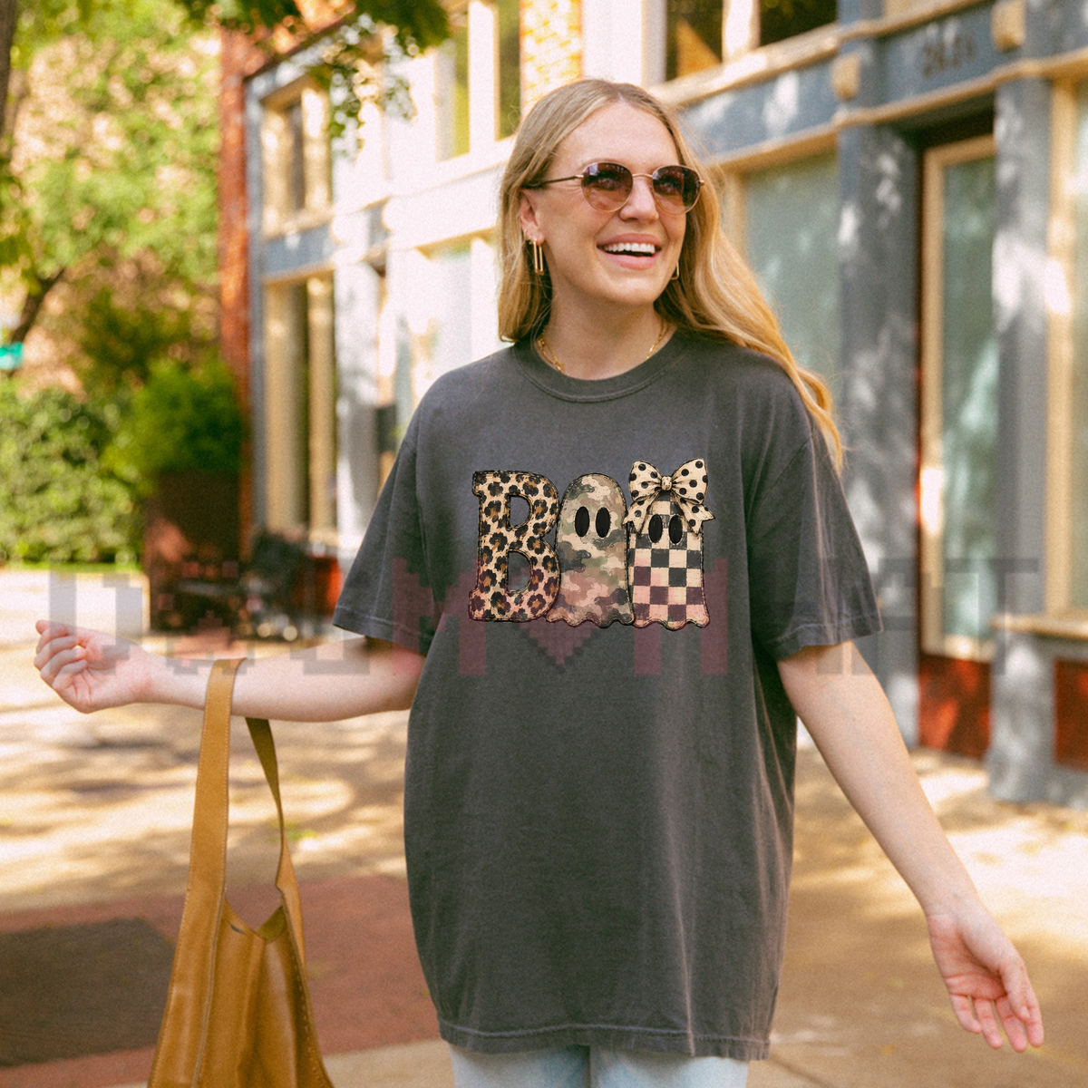 Front view of the spooky safari glam tee displaying leopard camo BOO typography graphic artwork across the chest of a Comfort Colors shirt. - dogmomhat