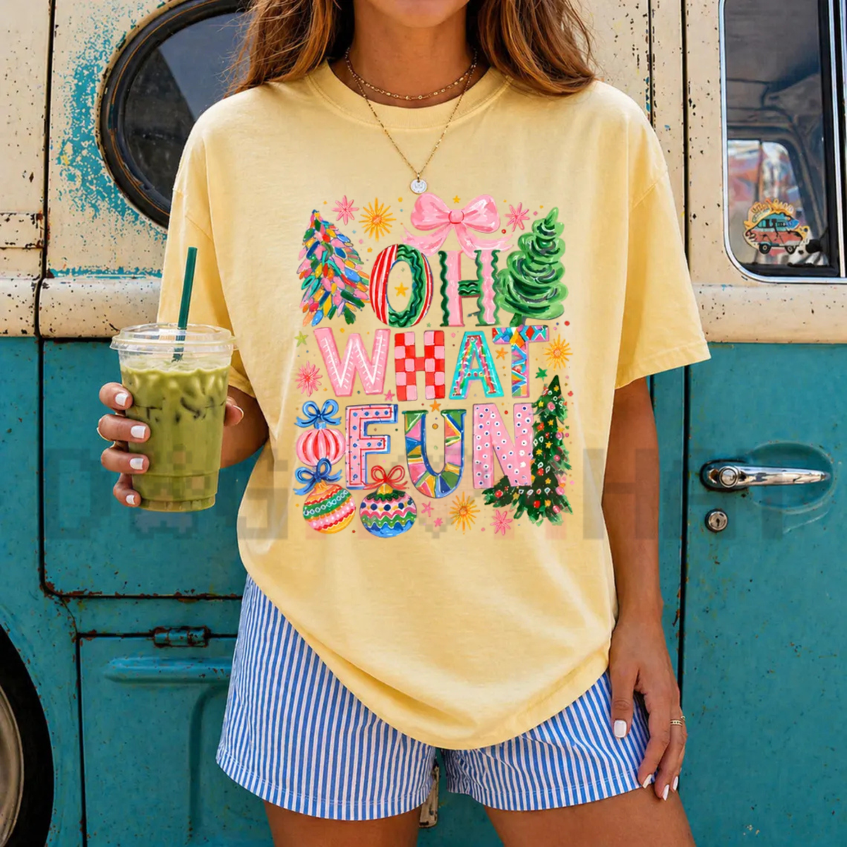 Front view of the t-shirt displaying pink coquette bows and colorful Christmas ornaments with 'Oh What Fun' typography across the chest of a soft crewneck shirt. - dogmomhat