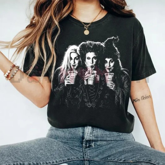 Front view of the washed pepper black Comfort Colors Hocus Pocus Iced Coffee Halloween Shirt showing the detailed character graphic print across the chest - dogmomhat