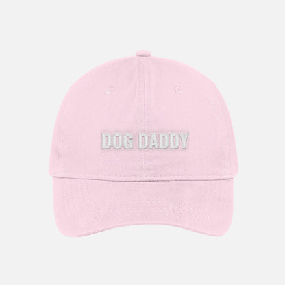 Blush pink pink dog daddy dad hat embroidered baseball cap with white text.