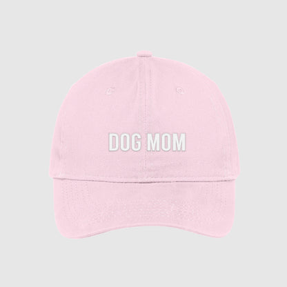 Blush pink Dog Mom Hat embroidered with white text.